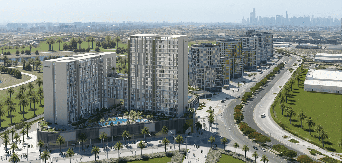 Aerial view of Jannat by Deyaar at Dubai Midtown, a luxury residential development. The photo shows the complex's tall buildings, lush green spaces, and swimming pools.