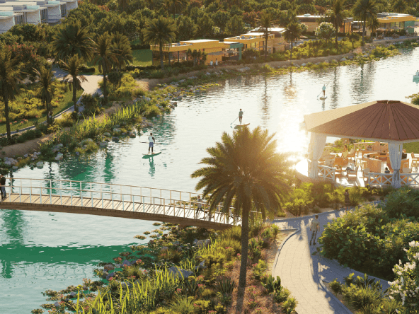The image shows the Malibu Bay artificial beach, the lazy river, the wave surfing pool, and the floating pool.