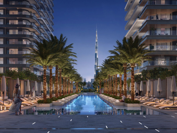 Four sleek residential towers of Address Residences Zabeel by Emaar Properties, overlooking greenery and Dubai’s skyline at dusk, including DIFC and Downtown