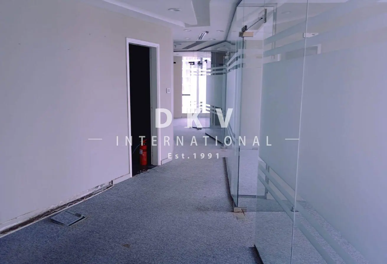 Regal Tower Business Bay – 1,495 sqft fitted office with canal view and 5 partitions